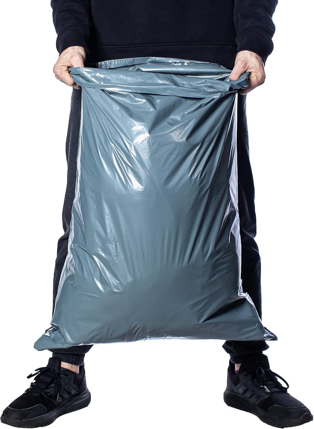 Large grey mailing bag held open by a person